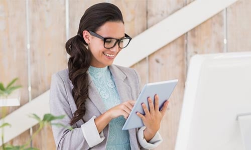 Professional reviewing information on a tablet