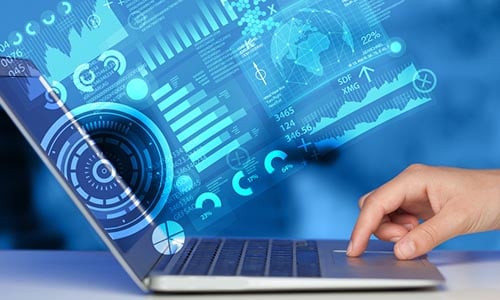 Hand interacting with a digital interface on a laptop